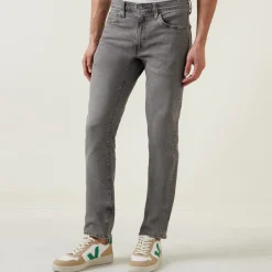 511™ Mid-Rise Slim Leg Jeans