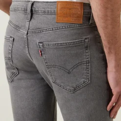 511™ Mid-Rise Slim Leg Jeans