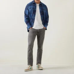 511™ Mid-Rise Slim Leg Jeans