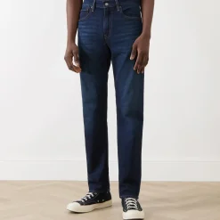 502™ Mid-Rise Tapered Jeans