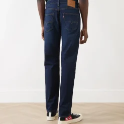 502™ Mid-Rise Tapered Jeans